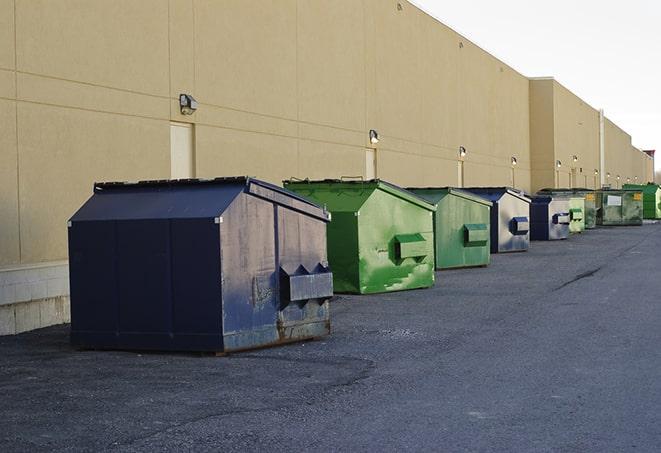 a pack of different construction bins lined up for service in Alameda